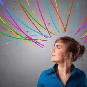 Pretty young girl thinking with colorful abstract lines overhead